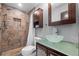 Stylish bathroom featuring tiled shower, vanity with glass bowl sink, and modern fixtures at 2302 16 W St, Palmetto, FL 34221