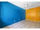 Bare bedroom with tile floors, ceiling fan, and brightly painted walls at 2302 16 W St, Palmetto, FL 34221