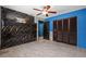 Bedroom features dark accent wall, closet, and tile flooring at 2302 16 W St, Palmetto, FL 34221