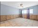Spacious bedroom features tile flooring, ceiling fan, and windows for natural light at 2302 16 W St, Palmetto, FL 34221