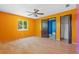 Empty bedroom featuring laminate flooring, closet, window, and freshly painted walls at 2302 16 W St, Palmetto, FL 34221