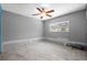 Bedroom with tile floors, ceiling fan, and window for natural light at 2302 16 W St, Palmetto, FL 34221