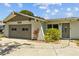 Charming single-Gathering home with a light exterior, attached garage, and well-manicured lawn at 2302 16 W St, Palmetto, FL 34221