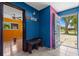 Inviting foyer with tile flooring, colorful walls, and a glimpse into the living spaces at 2302 16 W St, Palmetto, FL 34221