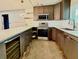 Kitchen featuring new cabinets, stainless steel appliances, and a stylish wine cooler at 2302 16 W St, Palmetto, FL 34221