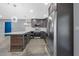 Modern kitchen featuring stainless steel appliances, updated cabinets, a wine cooler, and a stylish pendant light at 2302 16 W St, Palmetto, FL 34221
