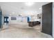 Inviting open concept kitchen area with bar, stainless steel appliances, and modern finishes at 2302 16 W St, Palmetto, FL 34221