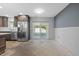 Bright and airy kitchen with modern appliances, including a stainless steel refrigerator and sliding door at 2302 16 W St, Palmetto, FL 34221