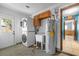 Laundry room with washer, dryer, sink, and water heater at 2302 16 W St, Palmetto, FL 34221