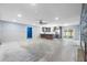 Bright and airy living room showing the open layout, kitchen, fireplace and sliding glass doors to the outside at 2302 16 W St, Palmetto, FL 34221
