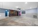 Open-concept living room with stylish wood-burning fireplace at 2302 16 W St, Palmetto, FL 34221