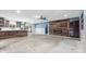 Spacious living room featuring a modern fireplace, ceiling fan and sliding glass doors to the outside at 2302 16 W St, Palmetto, FL 34221