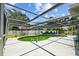 Enclosed pool and patio area providing outdoor relaxation and entertainment space at 2302 16 W St, Palmetto, FL 34221