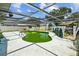 Backyard showcasing the pool under a screened enclosure, perfect for outdoor enjoyment at 2302 16 W St, Palmetto, FL 34221
