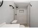 Bathroom with sleek, modern, walk-in shower, contemporary fixtures and stylish vanity at 4651 Helena Ne St, St Petersburg, FL 33703