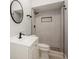 Elegant bathroom with a modern vanity, sleek fixtures, and tiled walk-in shower at 4651 Helena Ne St, St Petersburg, FL 33703