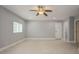 Bedroom featuring a ceiling fan, tile floors and natural light at 4651 Helena Ne St, St Petersburg, FL 33703