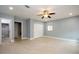 Large bedroom with a ceiling fan, ample closet space, and an ensuite bathroom at 4651 Helena Ne St, St Petersburg, FL 33703
