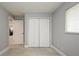 Light, airy bedroom featuring a closet and tiled flooring at 4651 Helena Ne St, St Petersburg, FL 33703