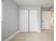 Neutral bedroom featuring ample closet space and tiled flooring at 4651 Helena Ne St, St Petersburg, FL 33703