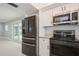 Well-equipped kitchen showcasing stainless steel appliances and ample counter space at 4651 Helena Ne St, St Petersburg, FL 33703