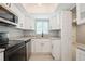 Bright kitchen featuring stainless appliances, ample counter space, and a window view at 4651 Helena Ne St, St Petersburg, FL 33703