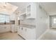 Open-concept kitchen with granite countertops, wine rack and modern lighting at 4651 Helena Ne St, St Petersburg, FL 33703