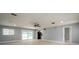 Bright living room with neutral paint, ceiling fan, recessed lighting, and sliding glass doors to the backyard at 4651 Helena Ne St, St Petersburg, FL 33703