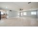 Spacious open floor plan with tile flooring, recessed lighting, and an adjacent kitchen area at 4651 Helena Ne St, St Petersburg, FL 33703