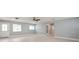 Bright, neutral living area with tile flooring, natural light, and an open layout at 4651 Helena Ne St, St Petersburg, FL 33703