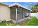 Enclosed screened-in porch providing a cozy outdoor area for relaxation and entertainment at 4651 Helena Ne St, St Petersburg, FL 33703