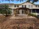 Backyard featuring a custom pergola over a paver patio at 915 Woodbridge Ct, Safety Harbor, FL 34695