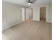Spacious bedroom with neutral carpet, ceiling fan, and multiple doors at 915 Woodbridge Ct, Safety Harbor, FL 34695