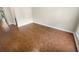 An empty room with wood flooring and neutral walls at 915 Woodbridge Ct, Safety Harbor, FL 34695