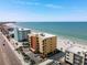Aerial view showcases building's beach proximity and convenient parking at 14146 Gulf Blvd # 3A, Madeira Beach, FL 33708