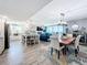 Open-concept living room features hardwood floors, modern furnishings, and ocean views from the large windows at 14146 Gulf Blvd # 3A, Madeira Beach, FL 33708