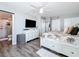 This main bedroom includes an ensuite bathroom, coastal accents, television, and ample storage at 14146 Gulf Blvd # 3A, Madeira Beach, FL 33708