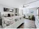 Bright and airy main bedroom with king bed, balcony access, and coastal decor at 14146 Gulf Blvd # 3A, Madeira Beach, FL 33708