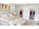Bright main bedroom featuring neutral decor, tray ceiling, and walk-in closets at 1160 Edinburgh St, North Port, FL 34288
