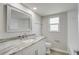 Clean bathroom featuring a tub and shower combo and granite vanity with framed mirror at 9497 122Nd Way, Seminole, FL 33772