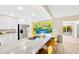 Bright, stylish kitchen with island seating, stainless steel appliances, and an open floor plan at 9497 122Nd Way, Seminole, FL 33772