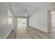 Spacious living room with an open layout, hardwood floors, and abundant natural light from sliding glass doors at 9497 122Nd Way, Seminole, FL 33772