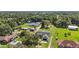 Overhead view of a home surrounded by dense trees and greenery at 1438 Mclin Dr, Plant City, FL 33565