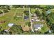 Aerial view of neighborhood and home showcasing expansive lots and mature trees at 1438 Mclin Dr, Plant City, FL 33565