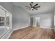 Bedroom with modern ceiling fan and large window at 1438 Mclin Dr, Plant City, FL 33565