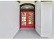 Stylish front entry with a vibrant red double door at 1438 Mclin Dr, Plant City, FL 33565