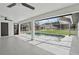 Spacious lanai featuring a screen enclosure and tranquil pool view at 1438 Mclin Dr, Plant City, FL 33565