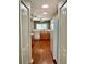 A view of the kitchen which features laminate countertops, wood cabinets and white appliances at 5864 Fishhawk Ridge Dr, Lithia, FL 33547