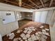 Living area with damaged ceiling and flooring, offering space for renovation and customization at 10315 Cortez W Rd # 18D, Bradenton, FL 34210