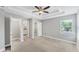 Bright bedroom with a ceiling fan, multiple closets, and access to the bathroom, offering convenience and ample storage at 3027 W Spruce St, Tampa, FL 33607